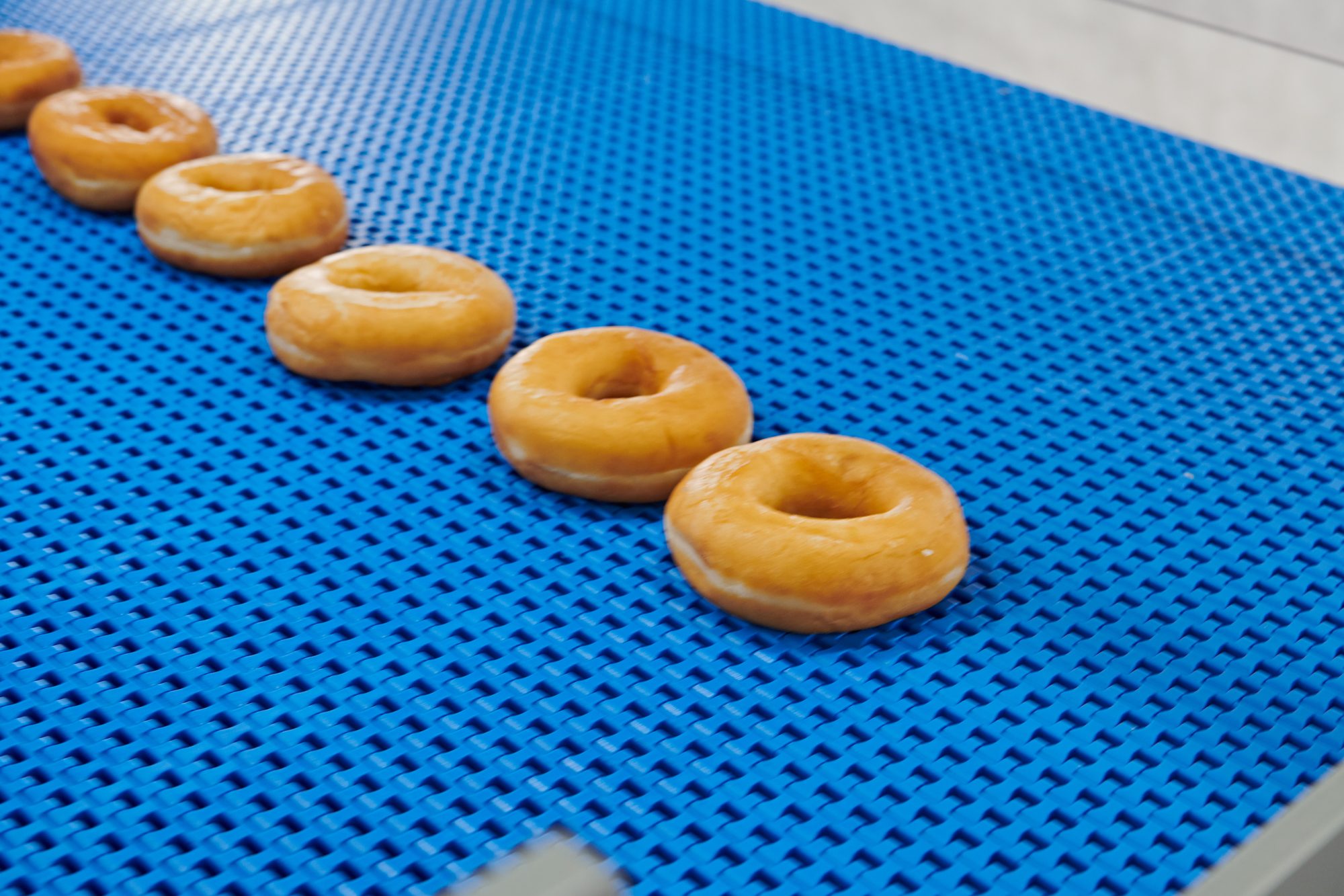 Donuts spaced evenly in one lane