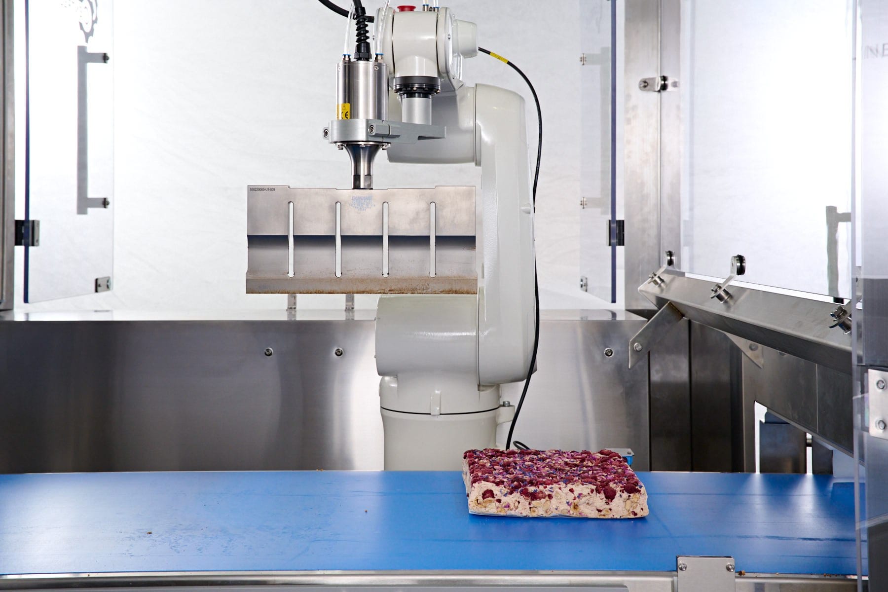 Ultrasonic blade cutting a topped slab
